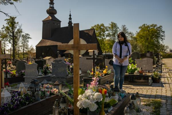 Image from "MY LIFE IS IN DANGER" - for NYTimes - Barbara Skrobol visiting the grave of her sister-in-law...
