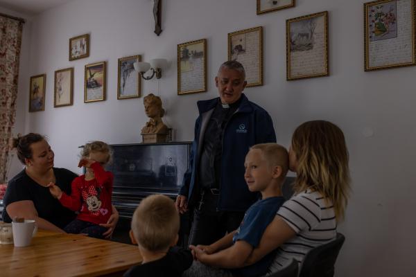 Image from "MY LIFE IS IN DANGER" - for NYTimes - Father Kancelarczyk at Little Feet House, a shelter he...