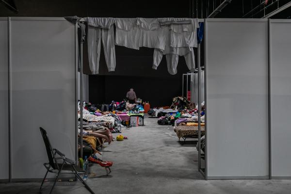 Image from OVER THE BORDER - The Expo Hall is one of the largest shelters for Refugees...