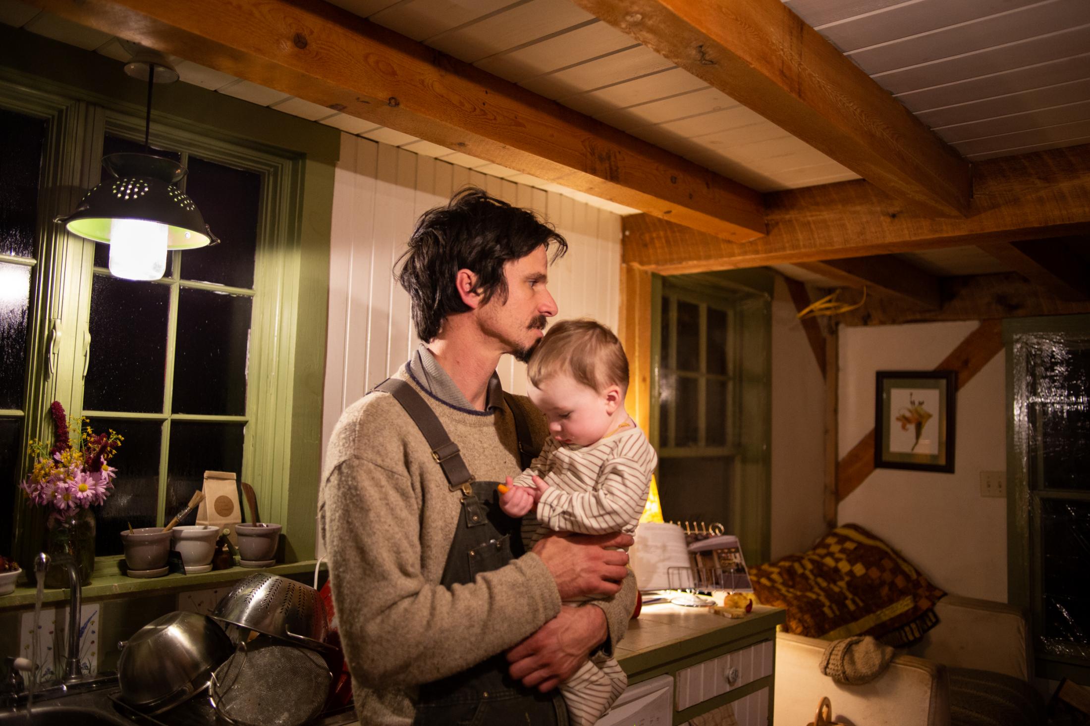 David holds his son before bed, Bremen, Maine, 2014.