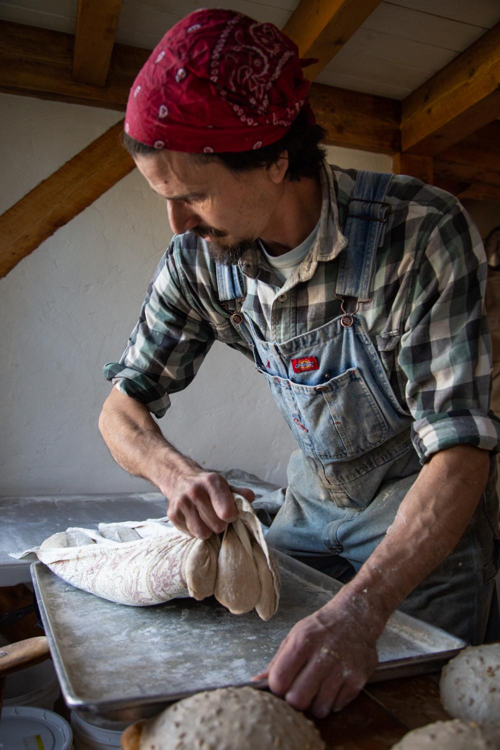 David makes bread by hand on Fridays for the Sunday market, Bremen, Maine, 2014.