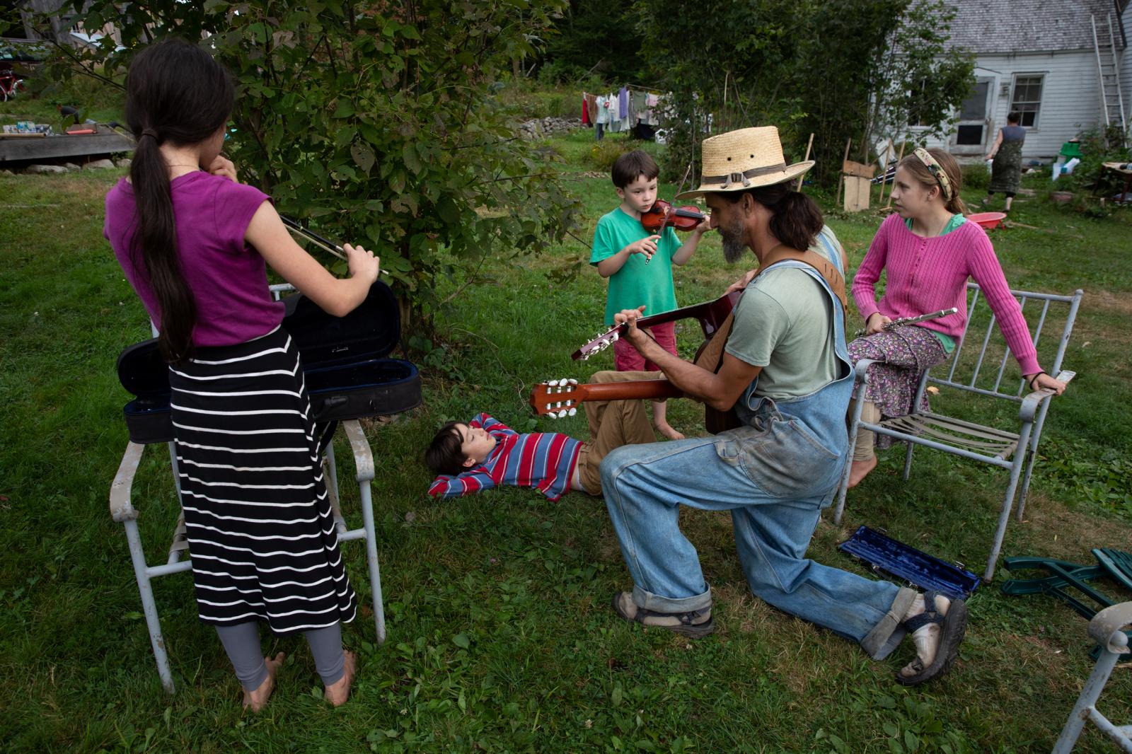 The family gathers together to play music, Bremen, Maine, 2014.