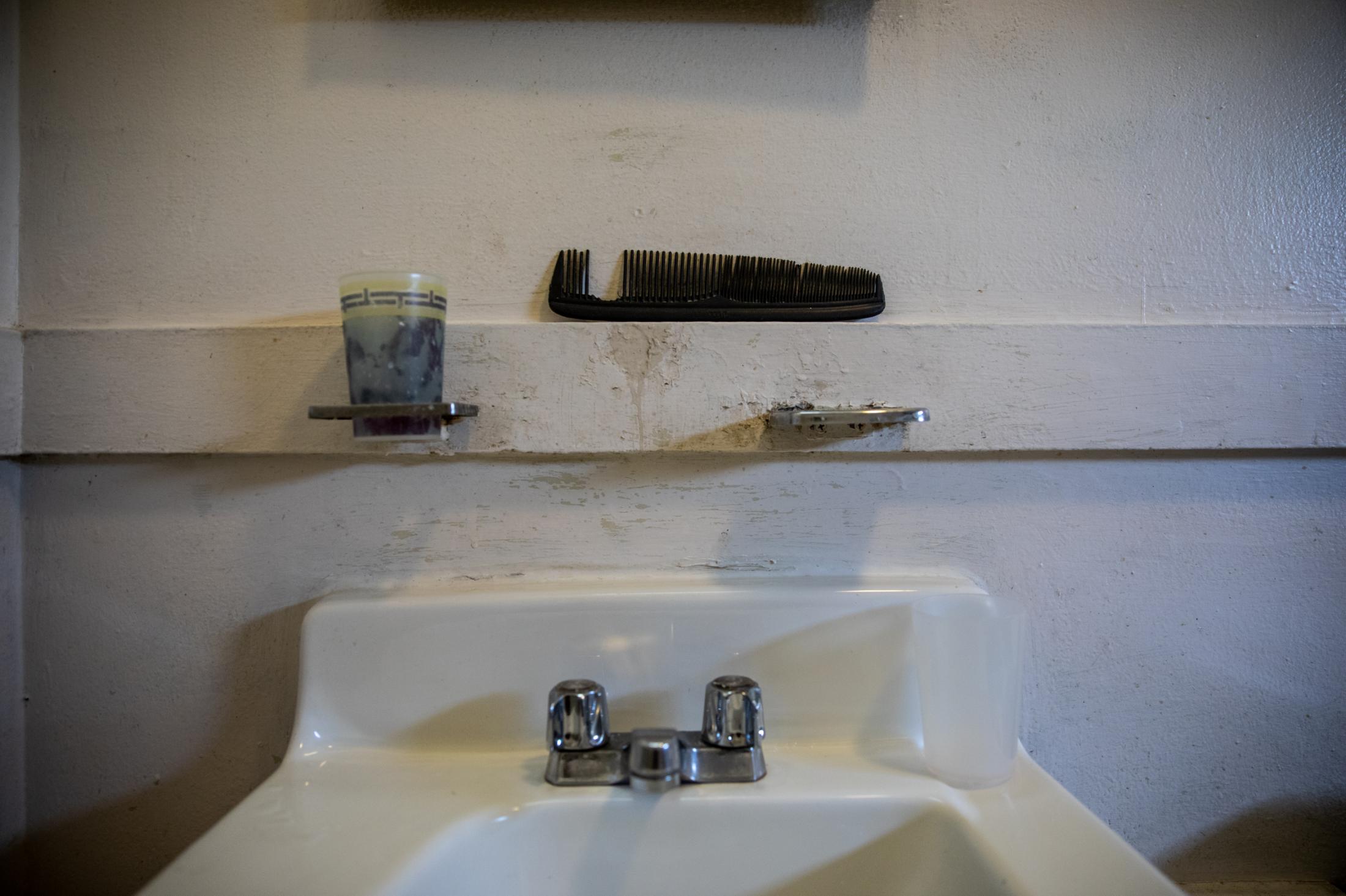Belonging - A comb sits in the bathroom of an immigrant family living...