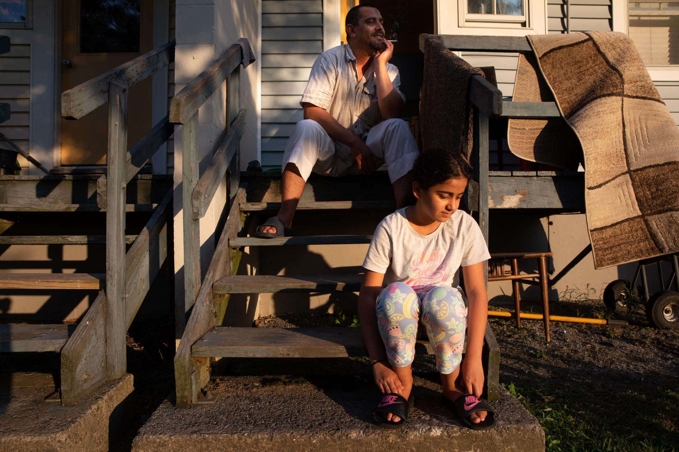 Belonging - Fatima and her dad, originally from Iran, sit outside...