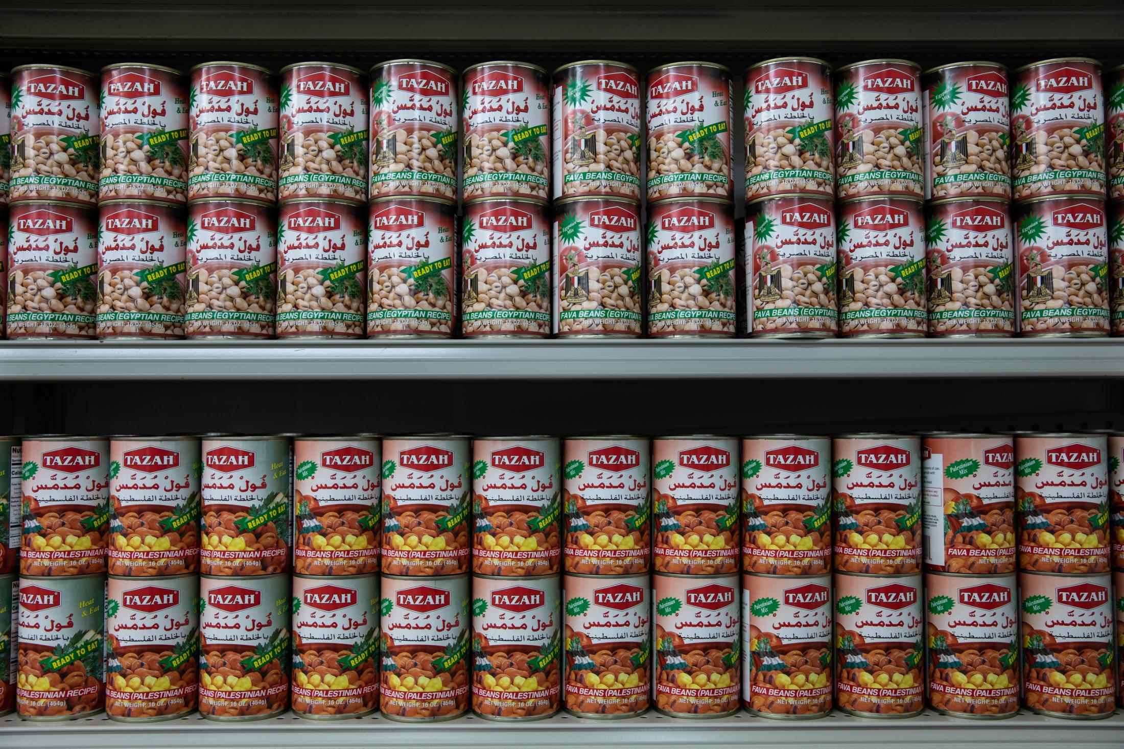 Belonging - Food cans sit on a shelf in an Iraqi market in Portland,...