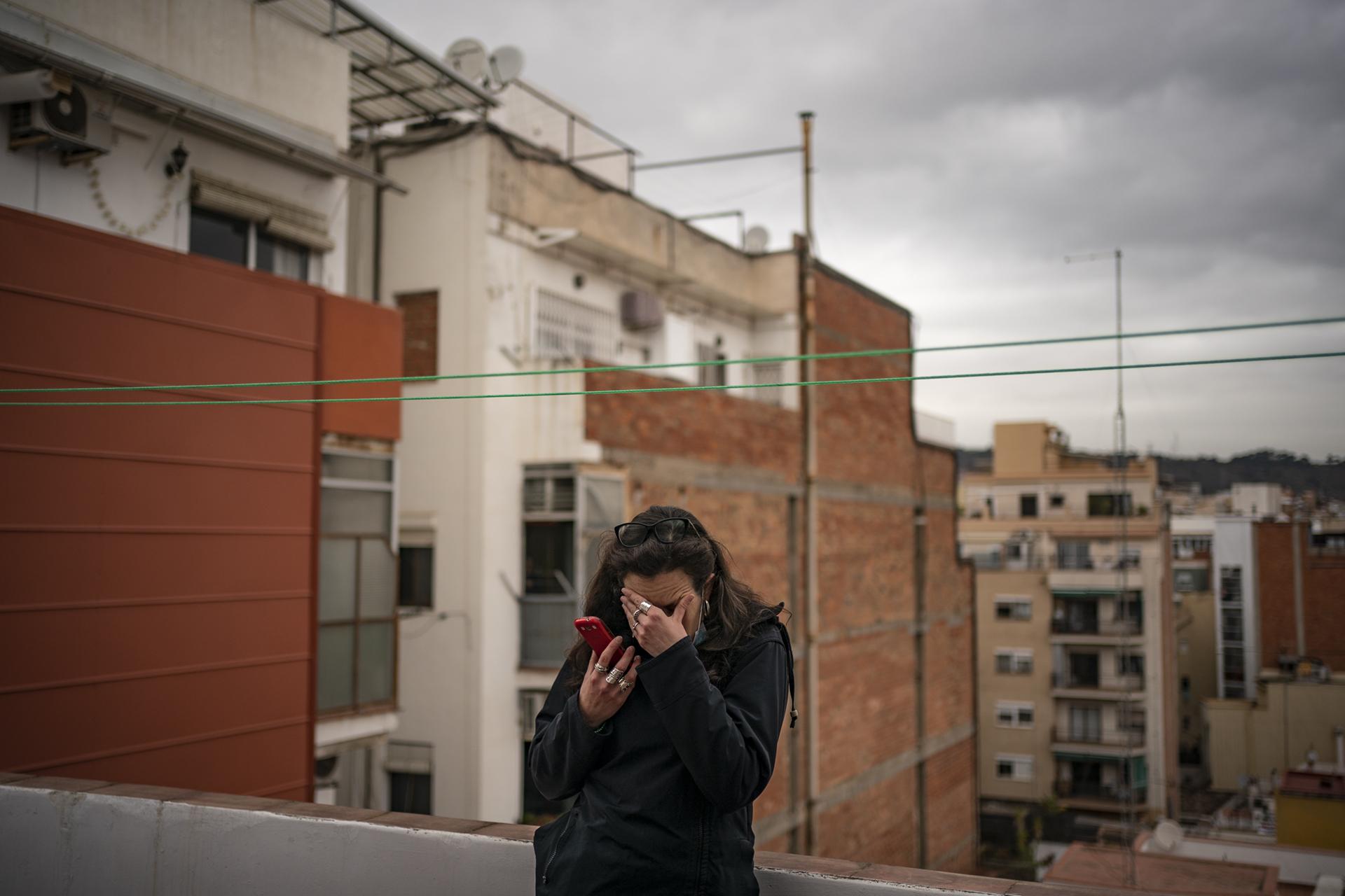  Noemi Tudela, 40, reacts as a friend tells her by phone that the police have arrived to evict her from her apartment in the Sant Andreu neighbourhood of Barcelona, on April 7, 2021. Ms. Tudela has been accused of squatting in the apartment of a owner who have multiples proprieties since March 2017. Tudela has vulnerable status. Despite the presence of dozens of activists, the eviction was carried out. &nbsp; &nbsp; &nbsp; &nbsp; &nbsp; &nbsp; &nbsp; &nbsp; &nbsp; &nbsp; &nbsp; &nbsp; &nbsp; &nbsp; &nbsp; &nbsp; &nbsp; &nbsp; 