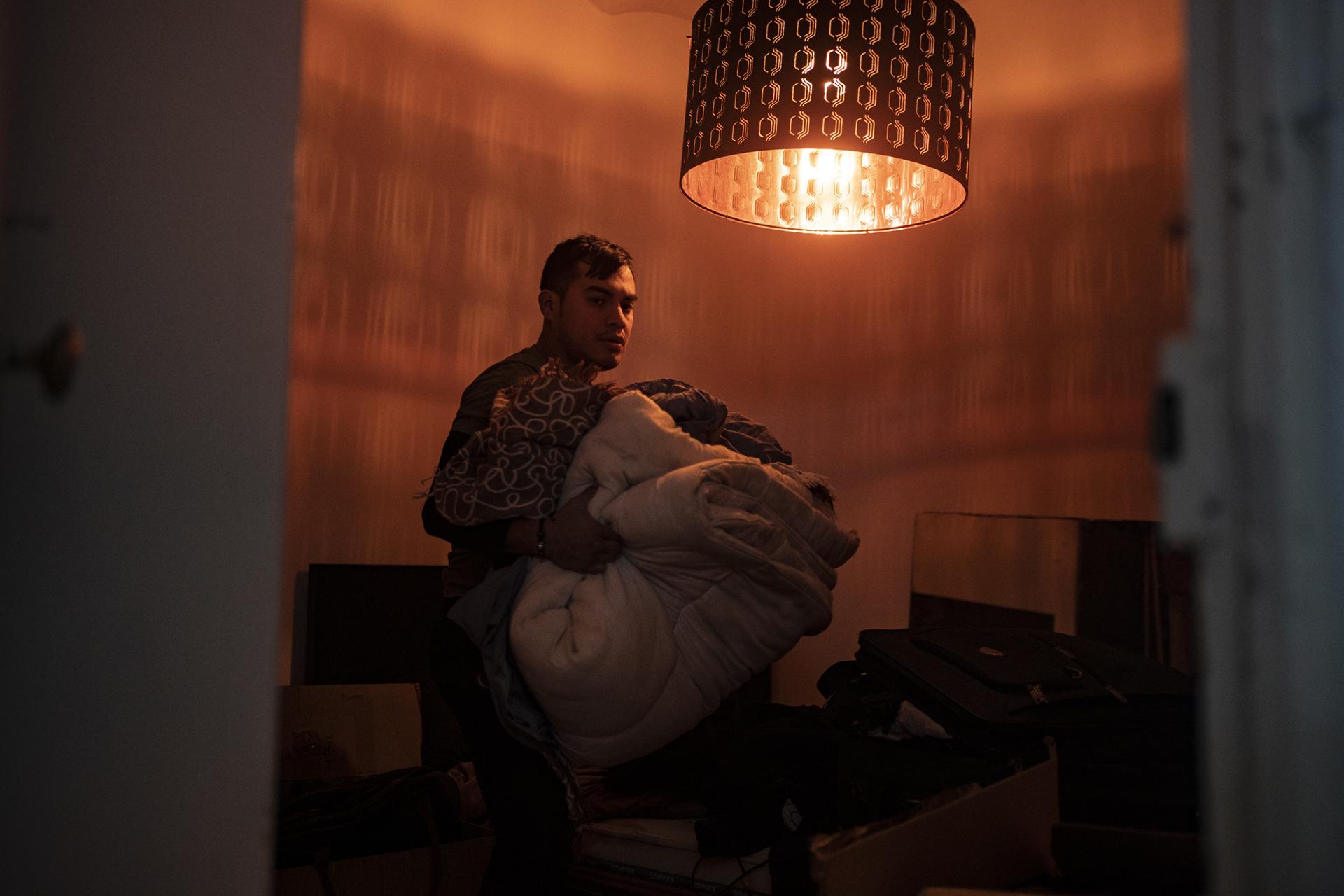  Alejandro IbanÌƒez, 30, collects his belonging from his apartment during the eviction from his apartment in Barcelona, Spain, Thursday, Dec.10, 2020. Alejandro has been accused of not making rent payments and not renewing his lease since February of 2020. Has vulnerable status and works as a delivery rider. (AP Photo/Joan Mateu) &nbsp; &nbsp; &nbsp; &nbsp; &nbsp; &nbsp; &nbsp; &nbsp; &nbsp; &nbsp; &nbsp; &nbsp; &nbsp; &nbsp; &nbsp; &nbsp; &nbsp; &nbsp; 