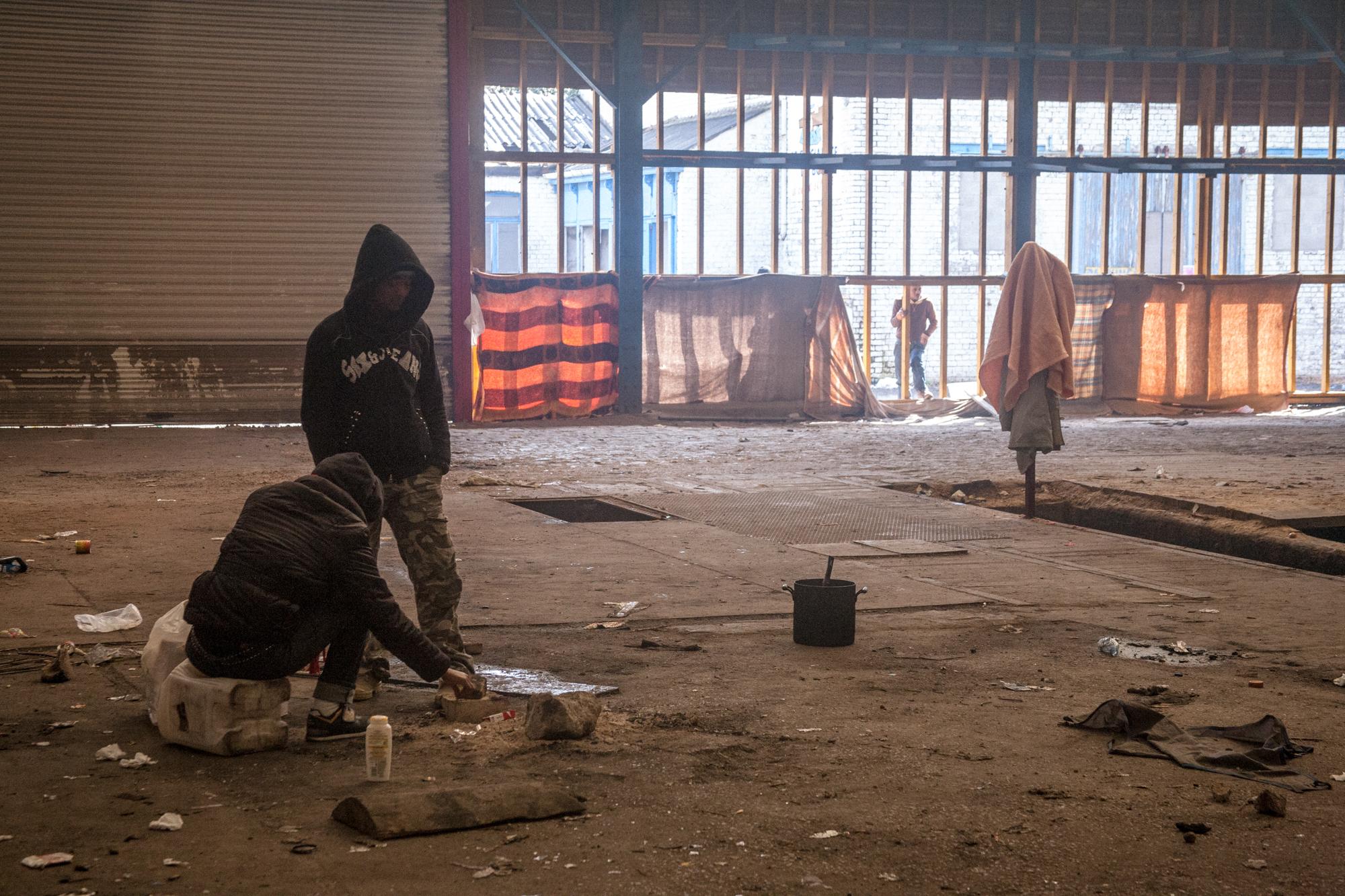 Eritrean and Sudanese immigrants living in empty saw mill and warehouse known as the...