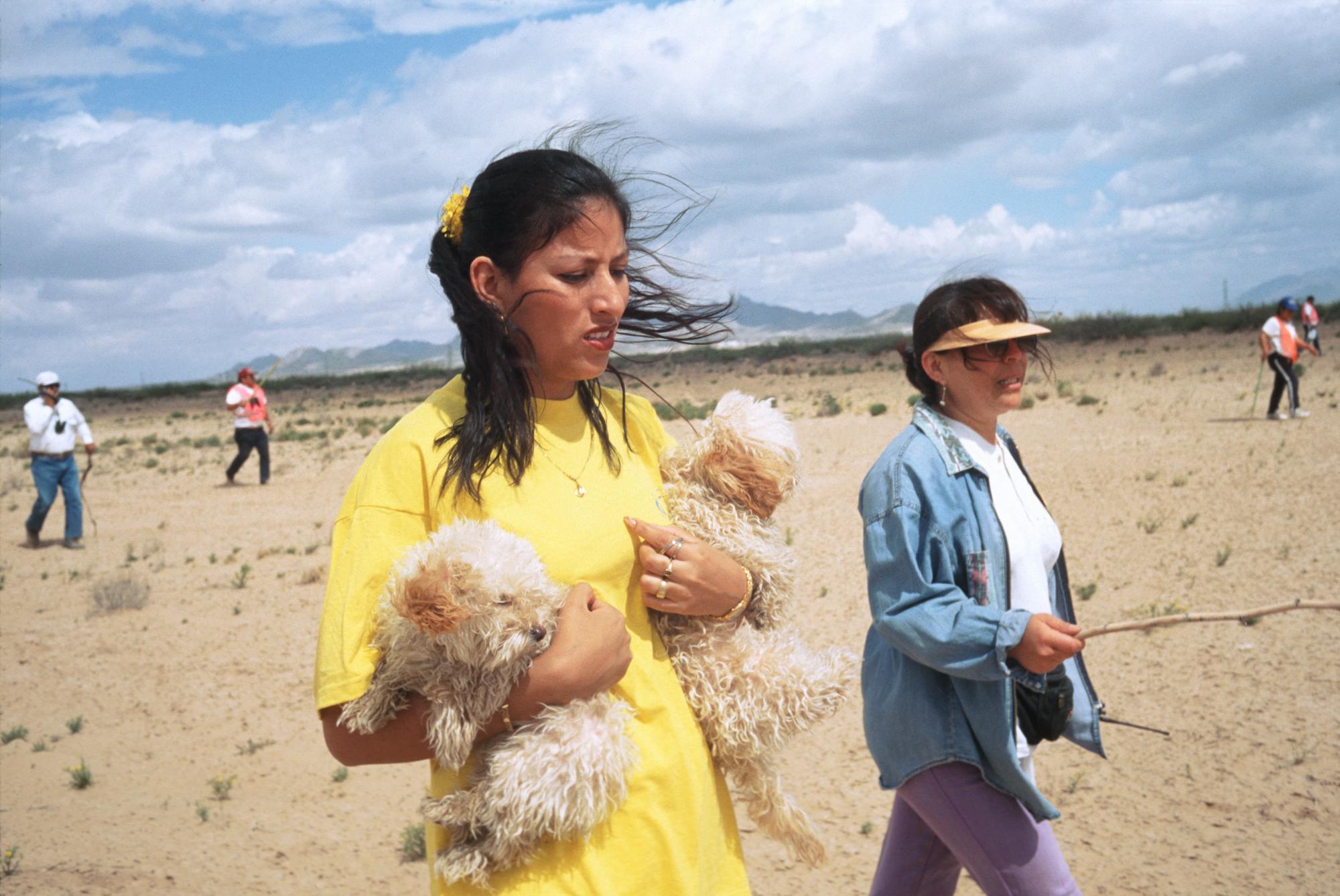 Missing Women of Juarez (1998) Search - Maria Luisa, holding family dogs, searches for her...