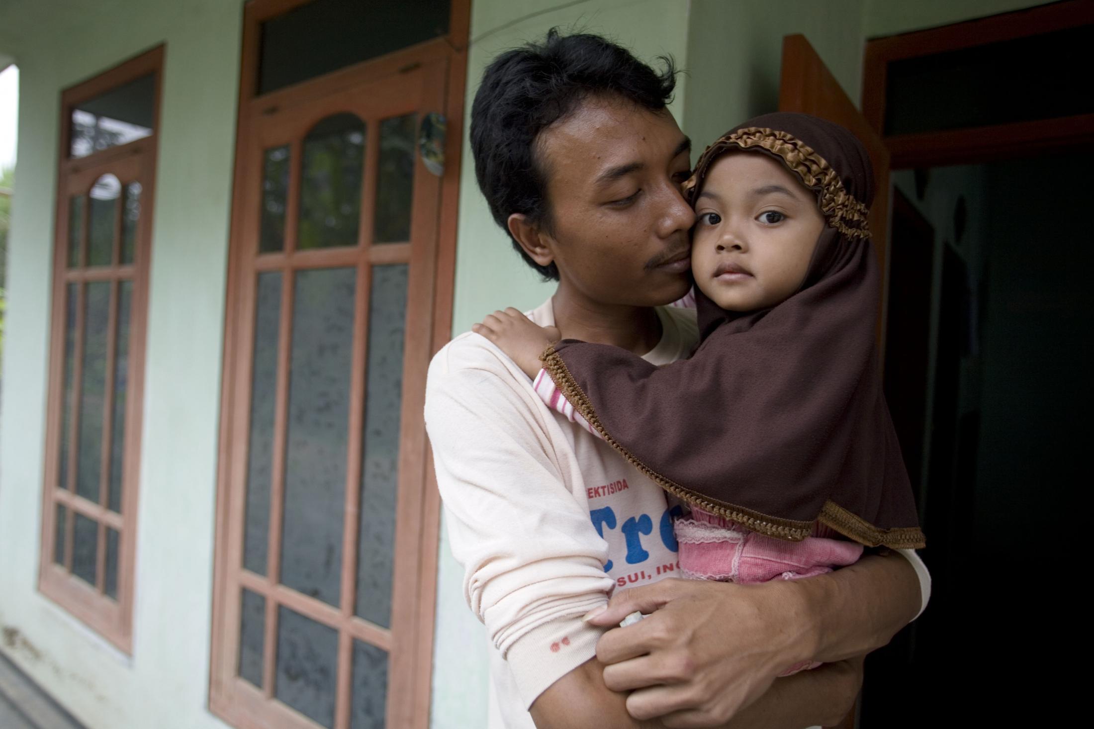 Suprianto, 27, is the primary caretaker for his 4 year old daughter Abigail. His wife,...