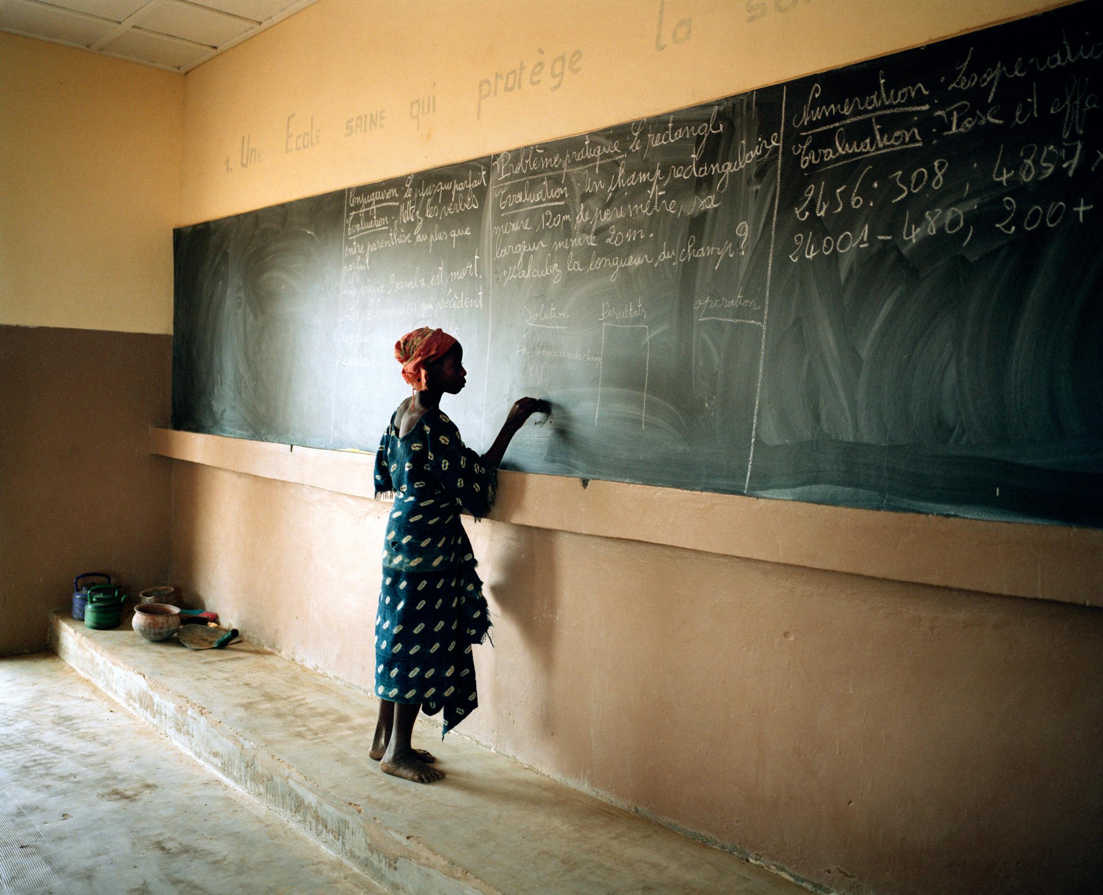 Fifth grader in village school. Tinto, Mali. 2007.