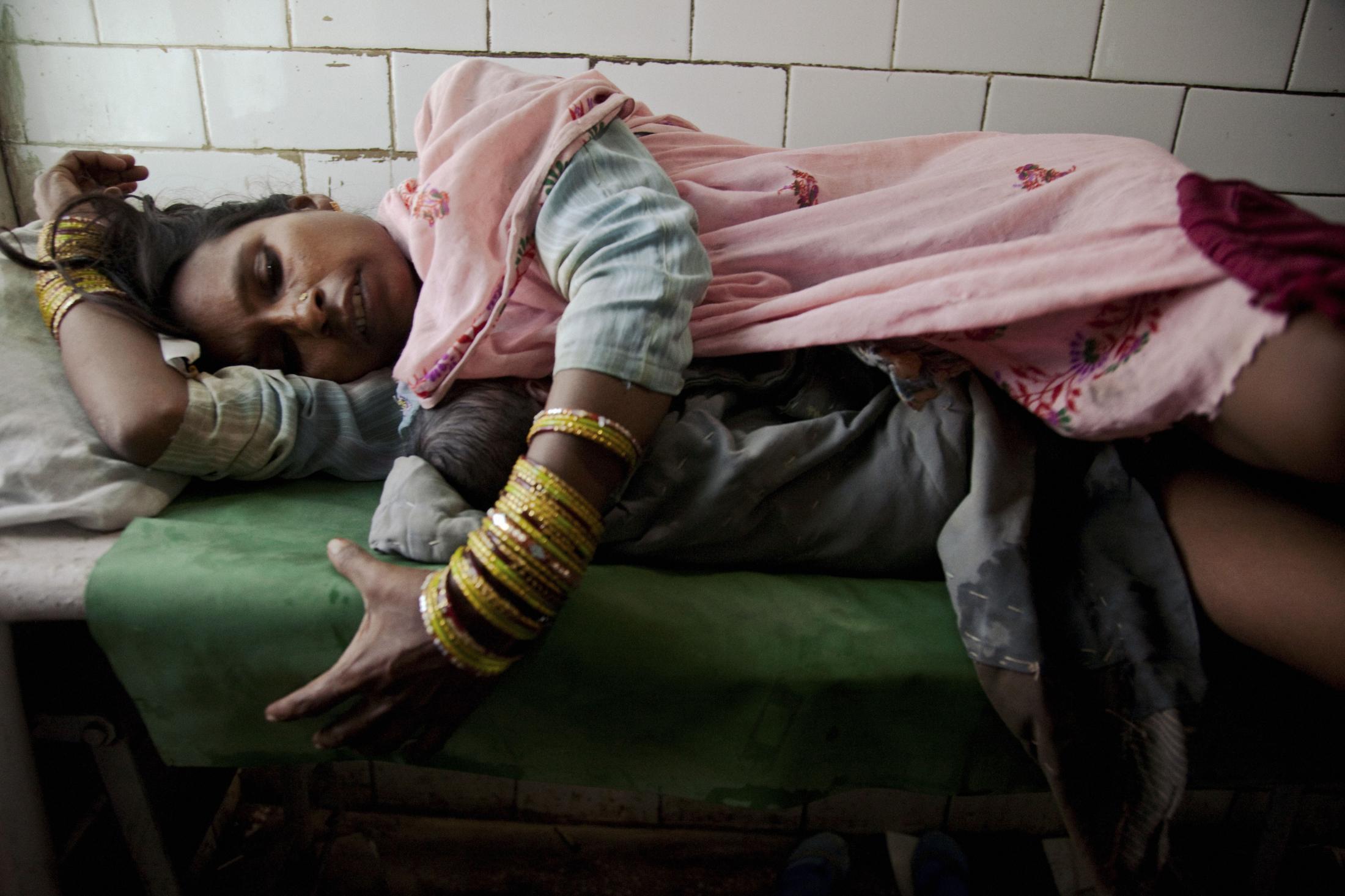 Shakeela rests following healthy delivery at PHC, Primary Health Center. Dewa, Uttar Pradesh,...