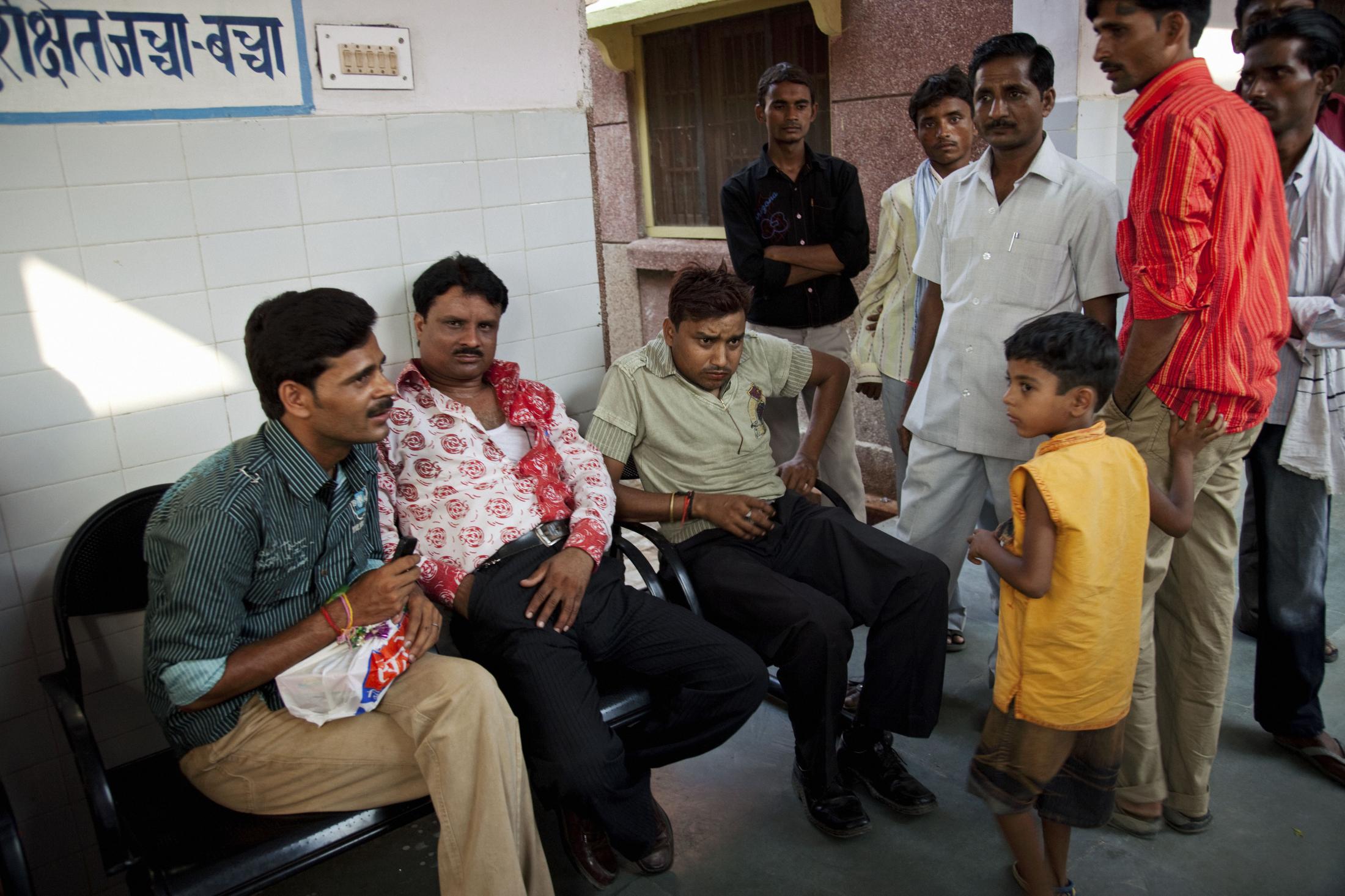 Maternal Mortality, India (2009) - Men waiting for news of newborns at the Barabanki...