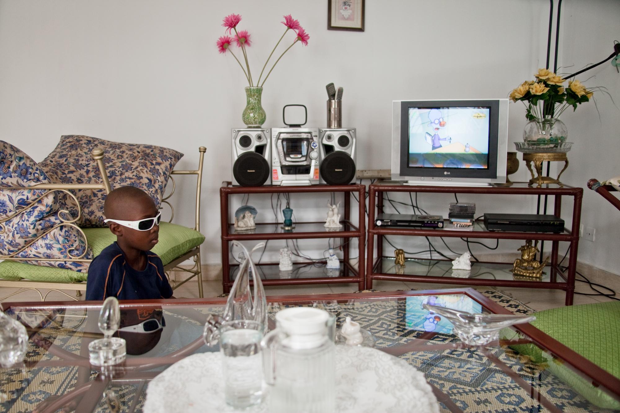 Roxal, age 10, a student from the INIPA school for the blind at home. Abidjan, Ivory Coast. 2010.