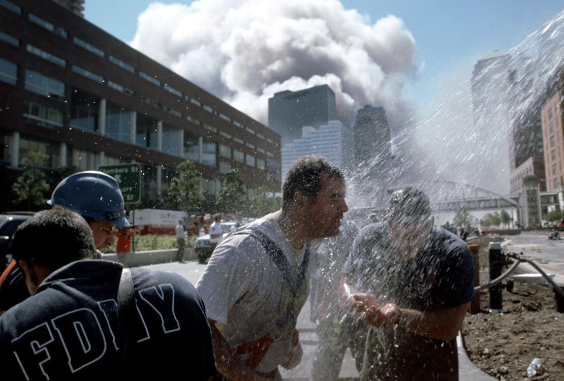 9/11 - Rescue workers clean off on the West Side Highway. The...