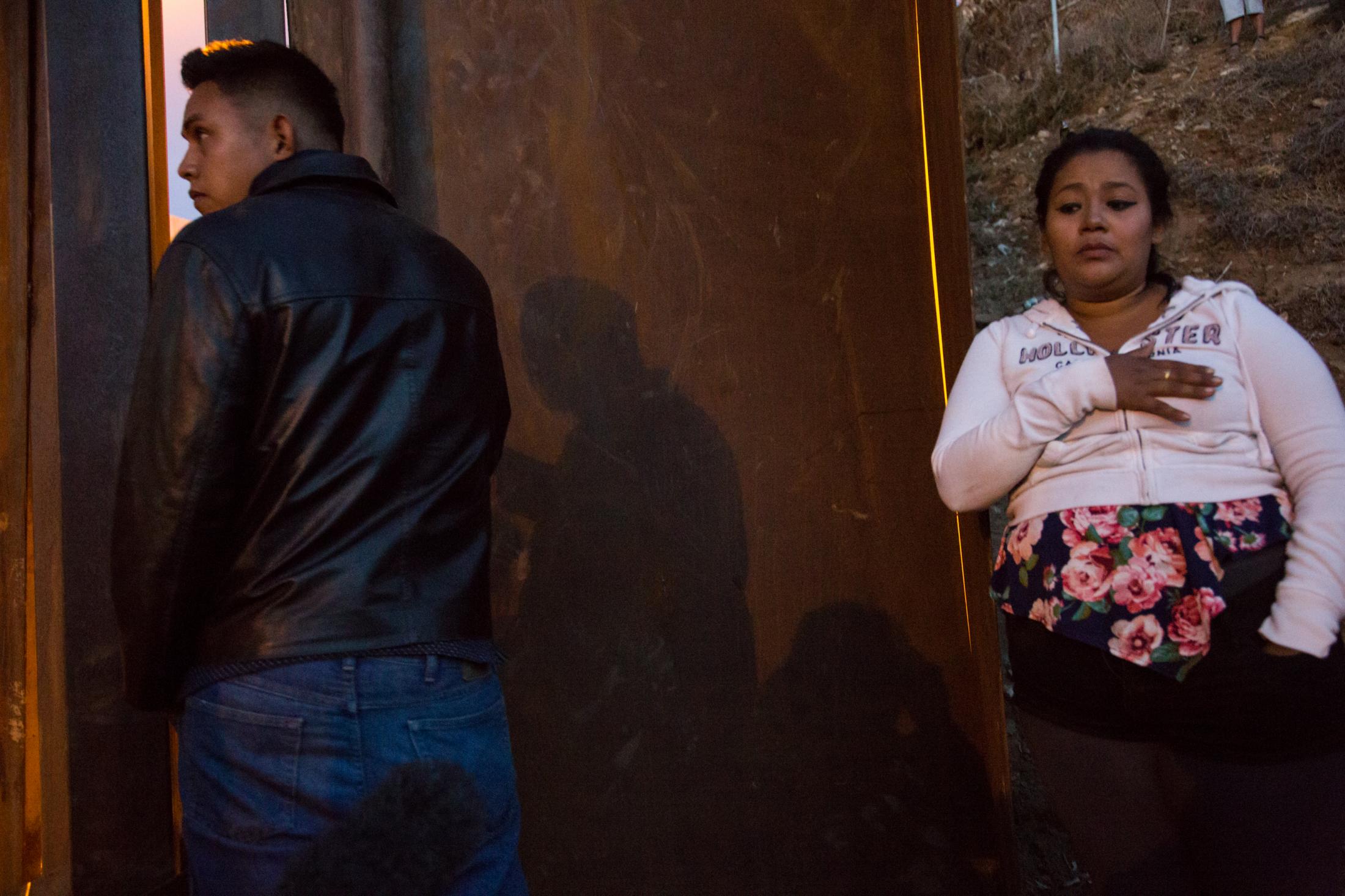 Sofia, 22, and her cousin, Dannel, waiting to enter the US illegally, over the wall at Tijuana...
