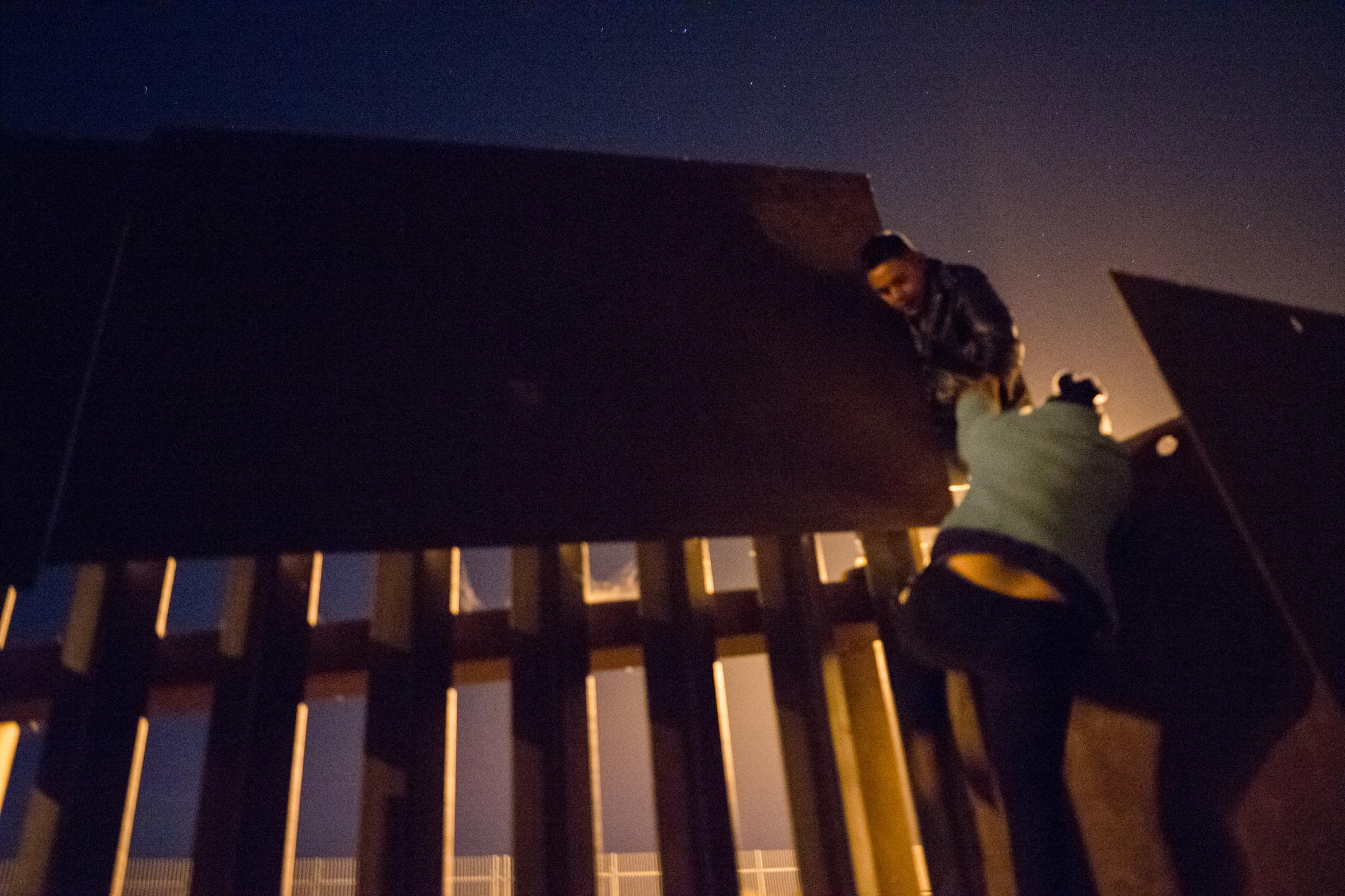Migrants entering the US illegally, over the wall at Tijuana beach. Tijuana, Mexico.&nbsp;