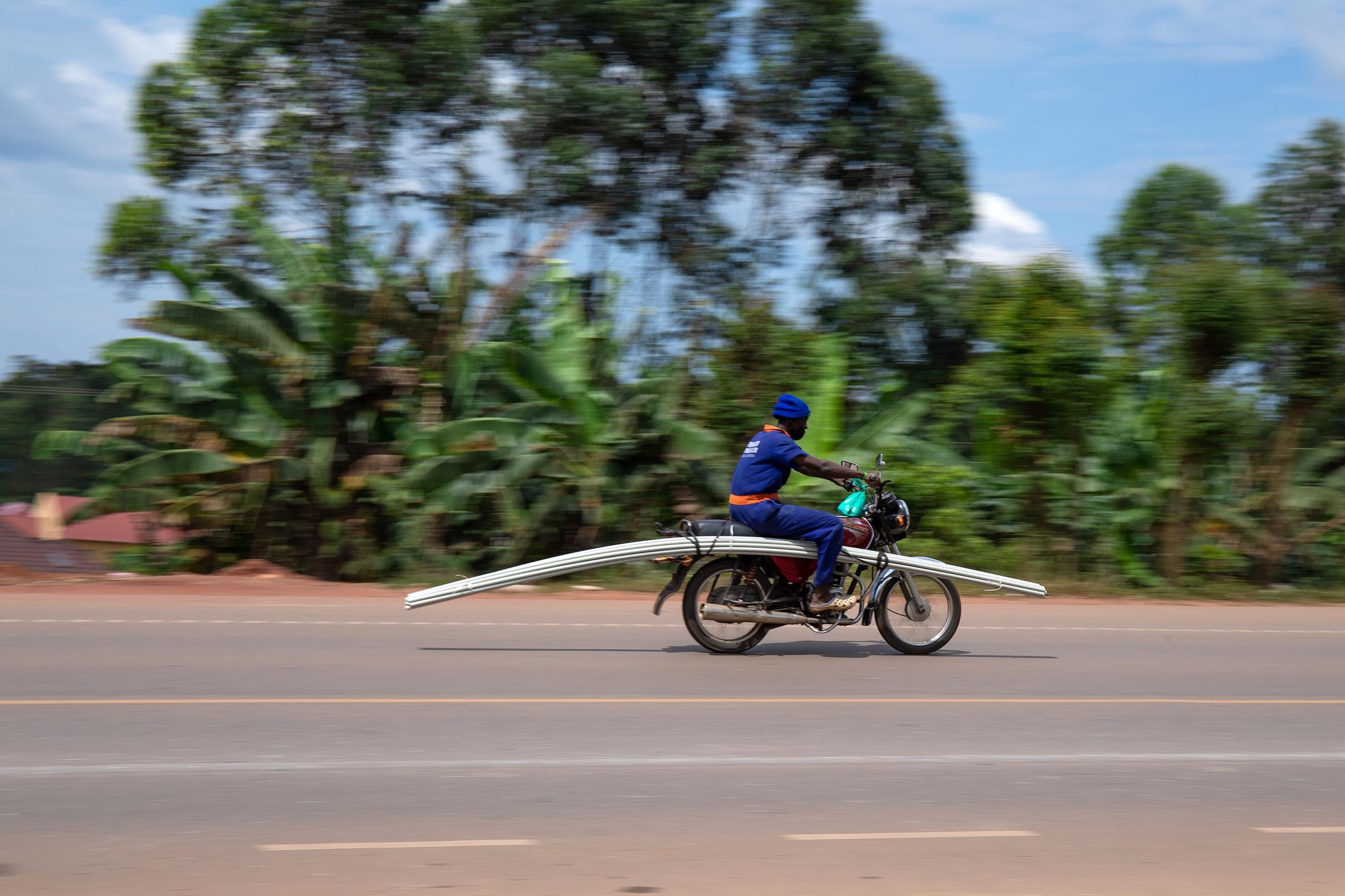 Domestic Express - A plumber seen speeding to his work site with his pipes tied onto the bike this was during the 42...