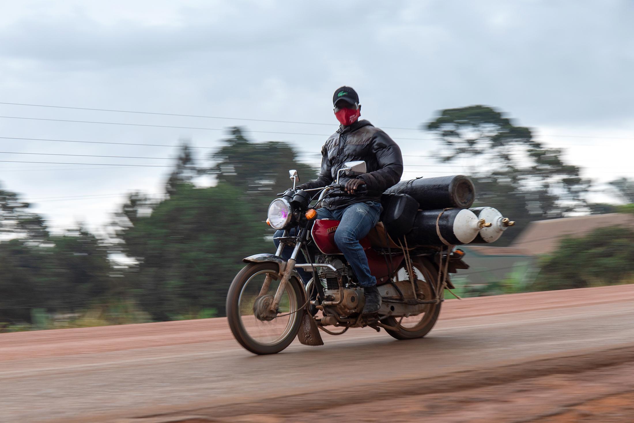 Domestic Express - A rider speeds with three Oxygen cylinders on his bike, the second wave of the covid-19...