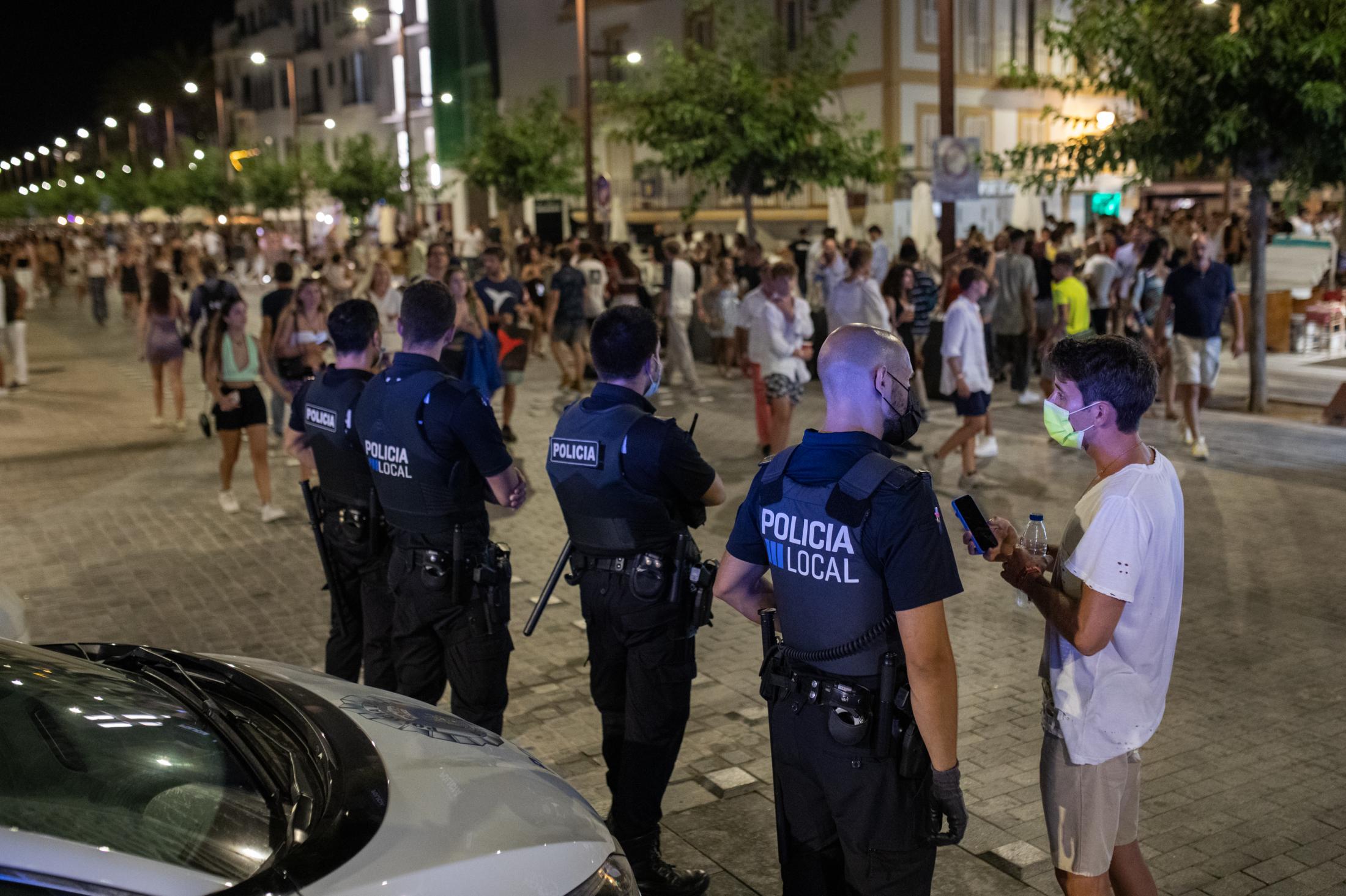 Covid-19: Ibiza Parties Infiltrated By Detectives - IBIZA, SPAIN - AUGUST 7: Police guard the nightlife area...