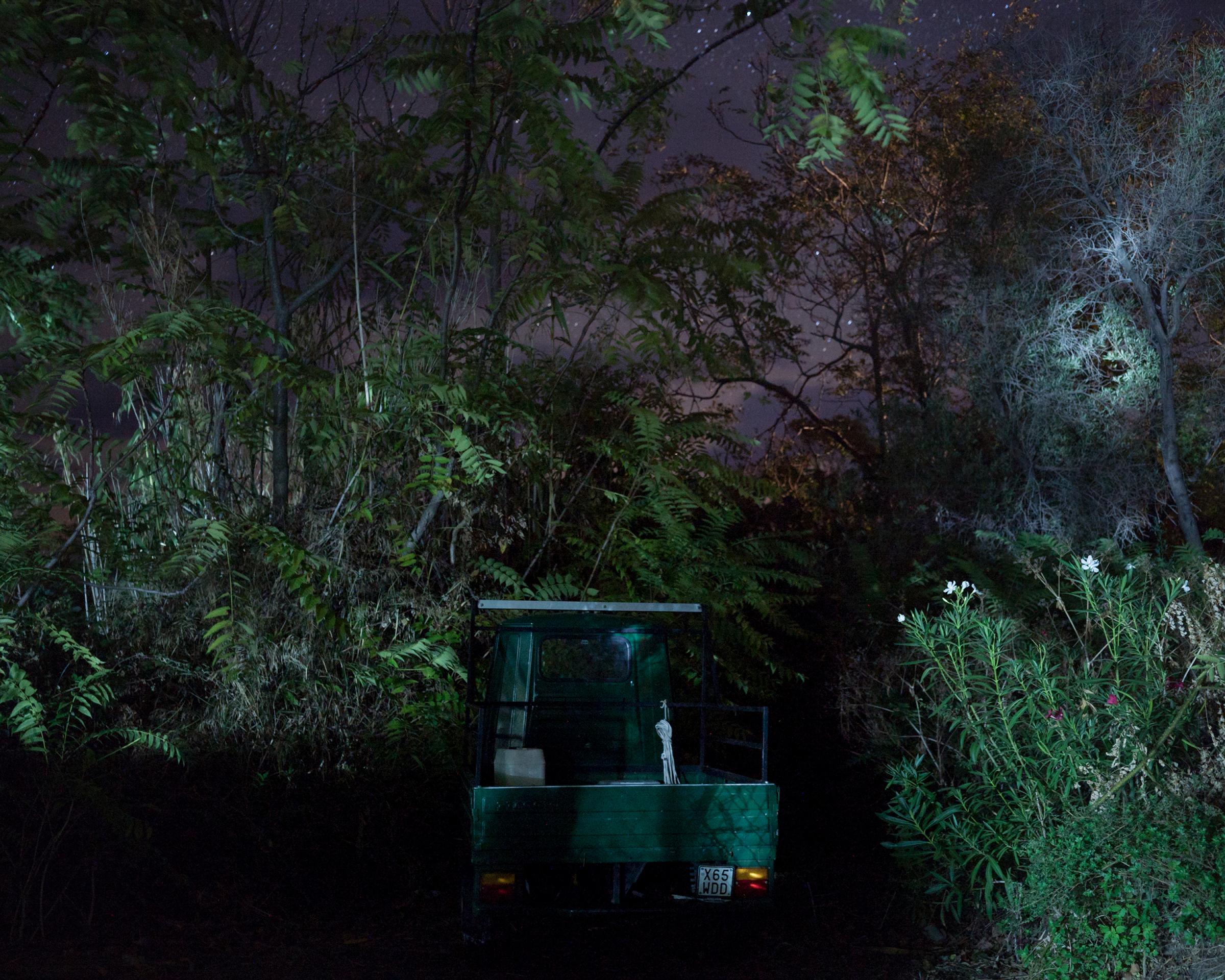 Visura interviews photographer Gaia Squarci - An Ape Car is photographed at night on Stromboli island. There are no lights in the streets on...
