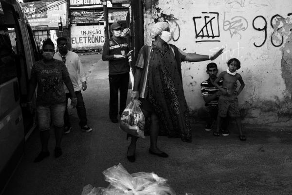 Rio's trans sex workers during COVID - Activist Indianare Siqueira (in the middle) distributes basic food parcels to trans people and...