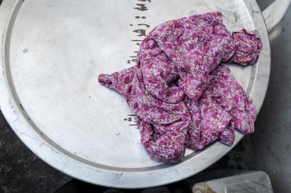 Ashura - Ashura - colourful rag left on top of a labelled cooking pot. Each family provides cooking pots...