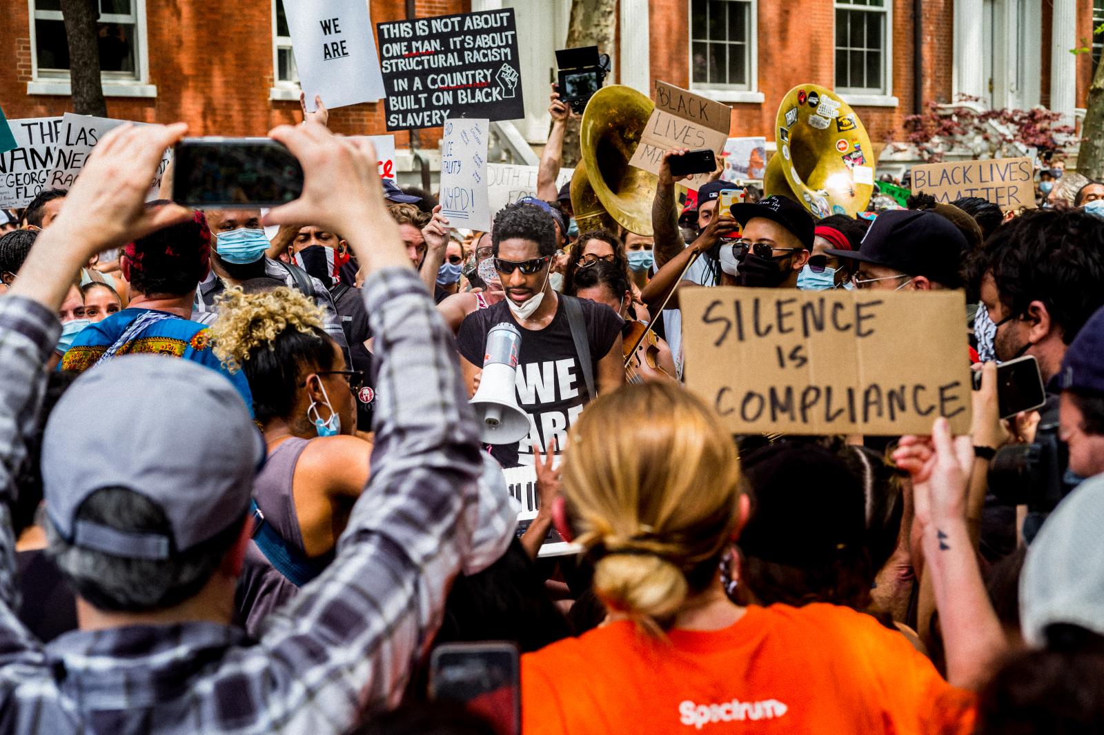 Image from Black Lives Matter -  Musician Jon Batiste leads a musical protest march into...