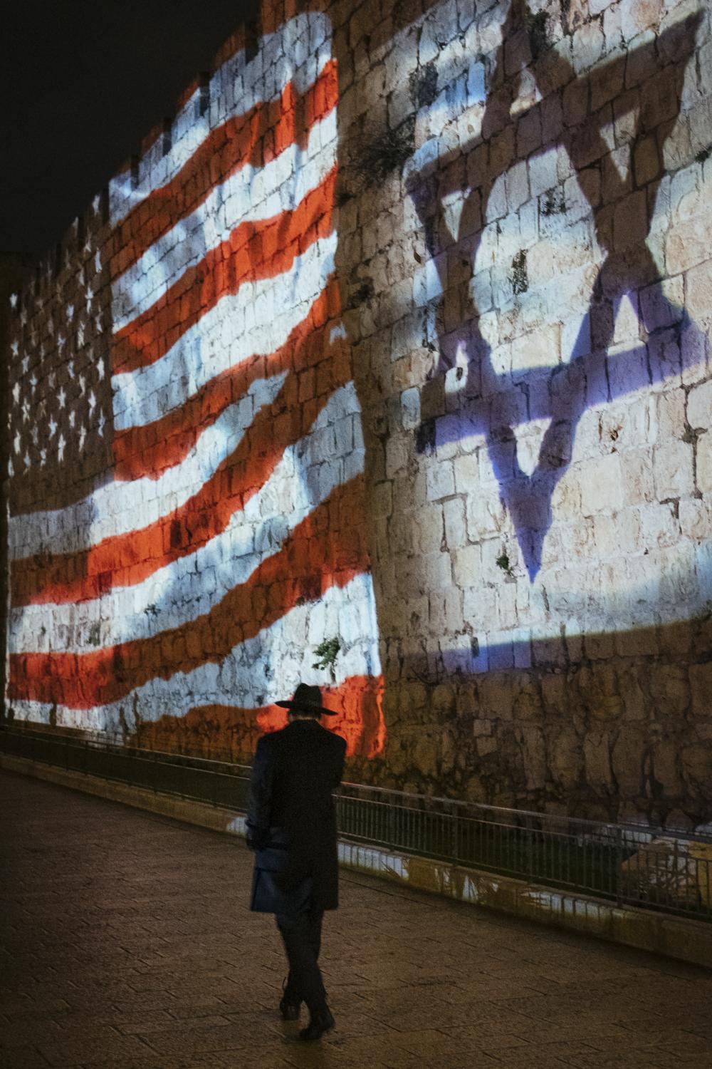 Au nom de tous les Saints - American and Israeli flags are flown together on the...