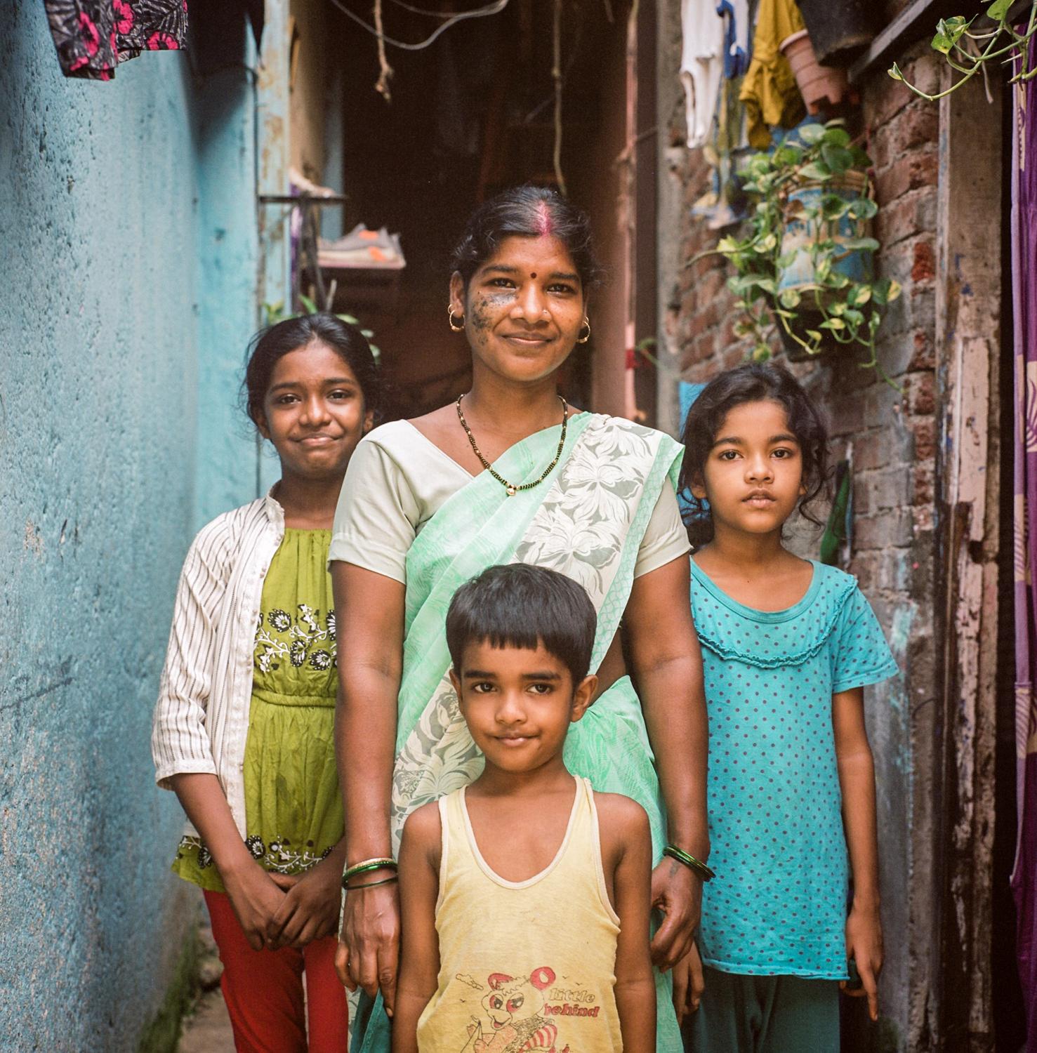 Single images - Urmila Verma, 30, and her three children outside of their...