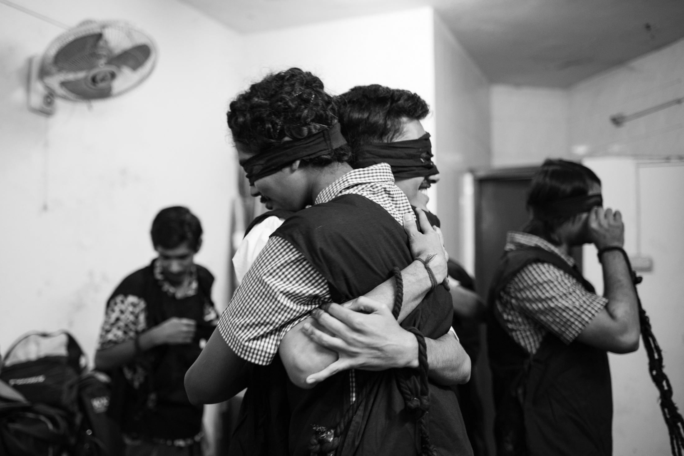 The Unseen Stage - They are saving their courage by hugging each other in...