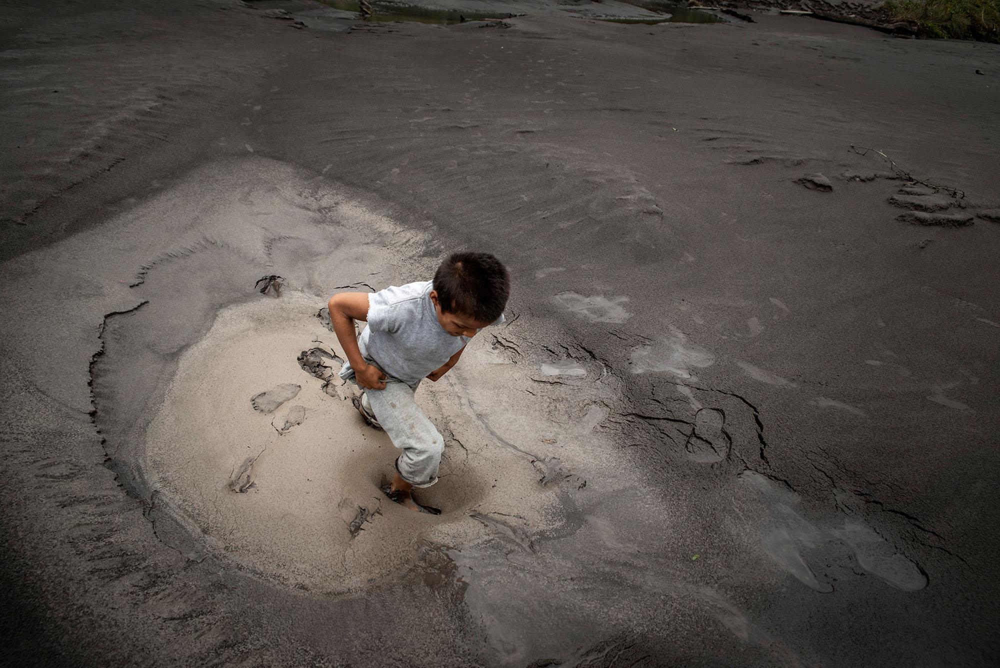 A child plays on the banks of the Napo River in the morning of April 27, 2021. The erosion of the...