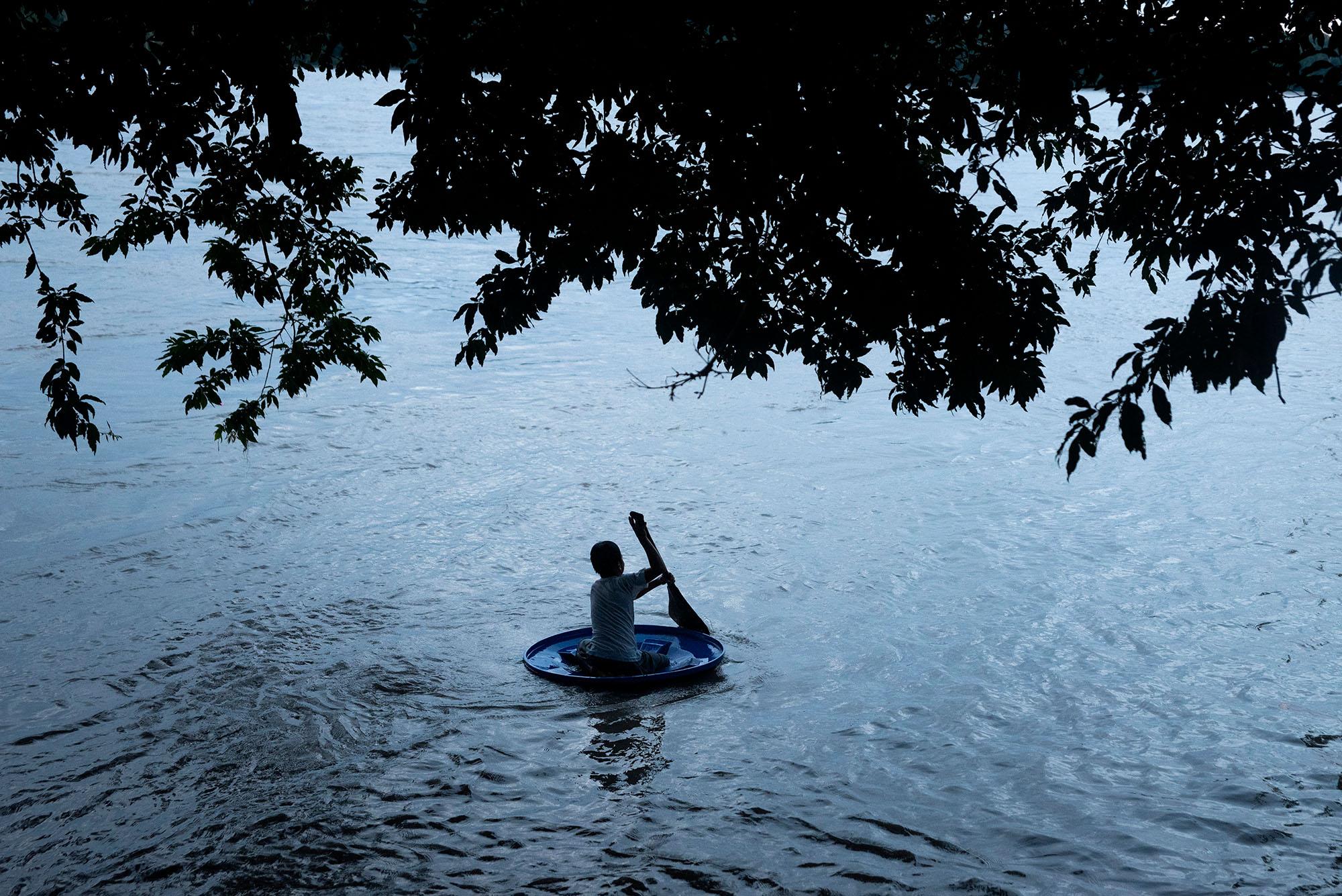 Andres Santy (9) plays in the Napo River on the afternoon of April 30, 2021. Andres&#39;...