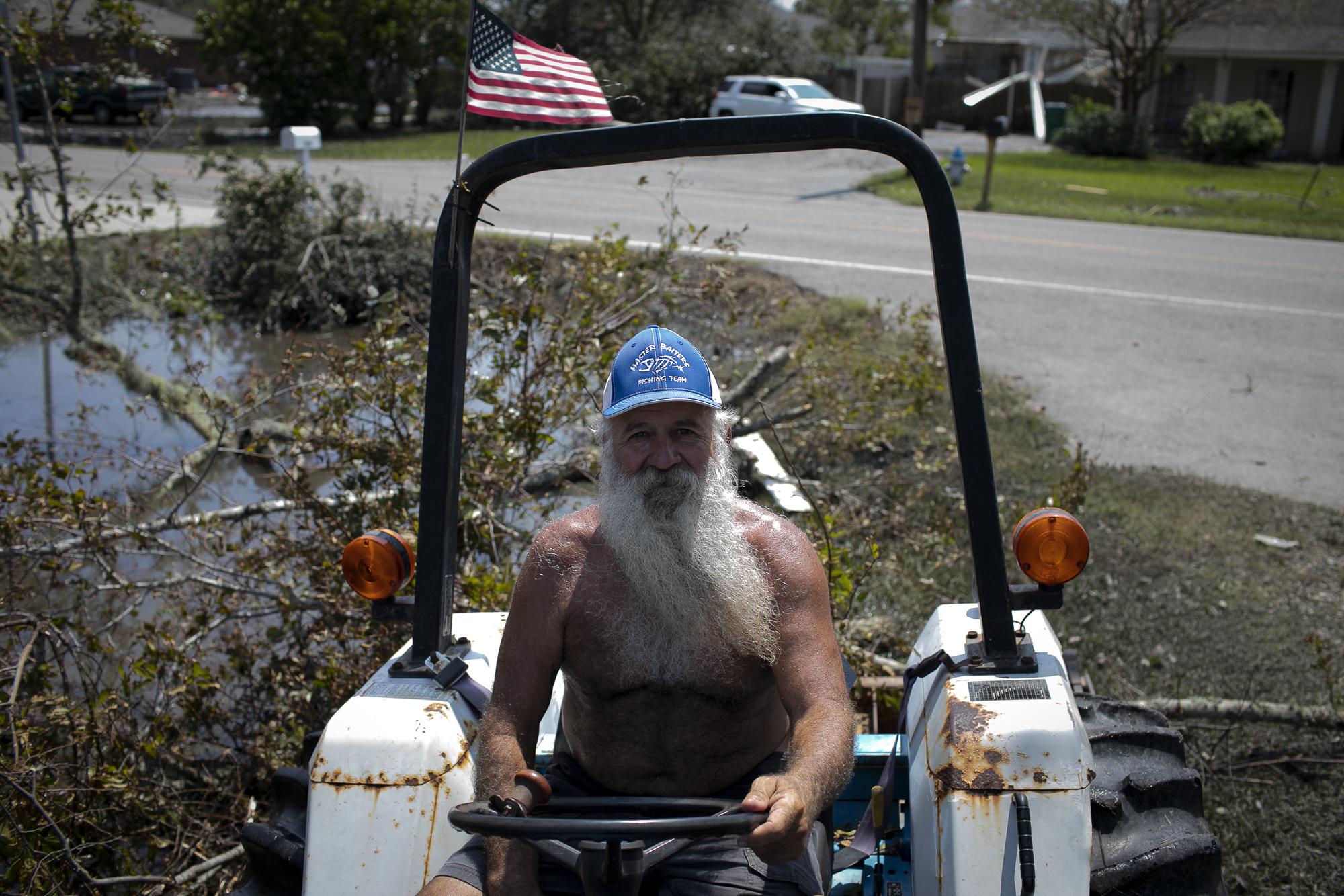 Hurricane Ida in Louisiana - Jay Casso poses for a photo as he cleans his property, in...