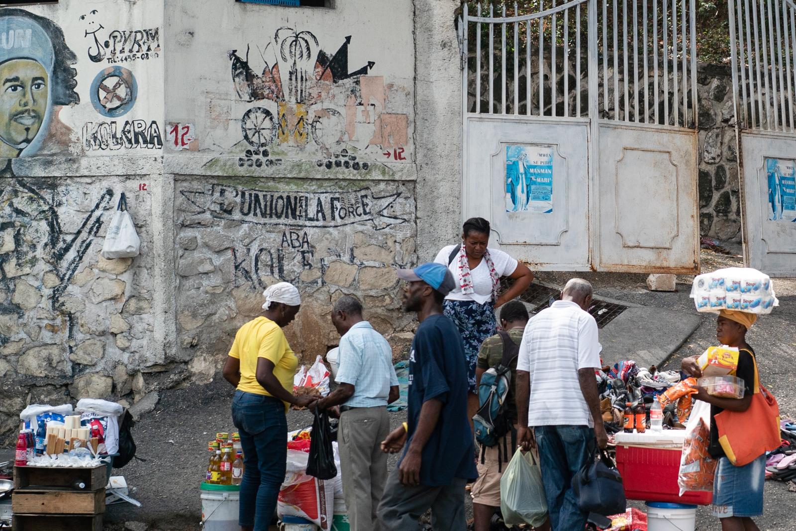 Street vendors in Port-au-Princ...ree-quarters of the population.