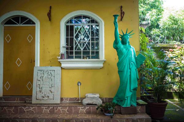 WELCOME TO INTIPUCA CITY - At Hugo Salinas and his uncle Alcides Andrade house. The liberty statue has been brought from the...