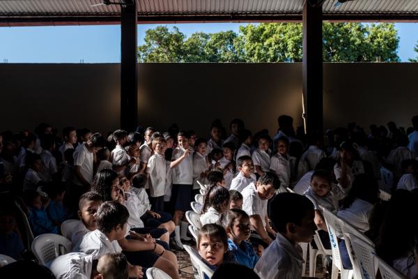 WELCOME TO INTIPUCA CITY - Pupils from the local schools are waiting for the school bag they will receive from the...