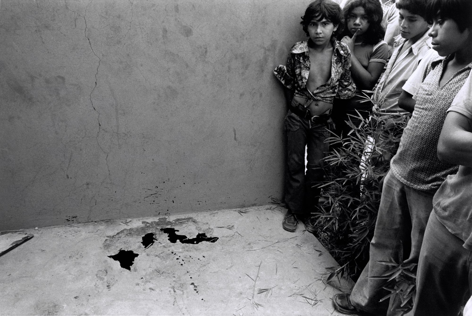 Blood of student slain while handing out political leaflets. San Salvador, 1979