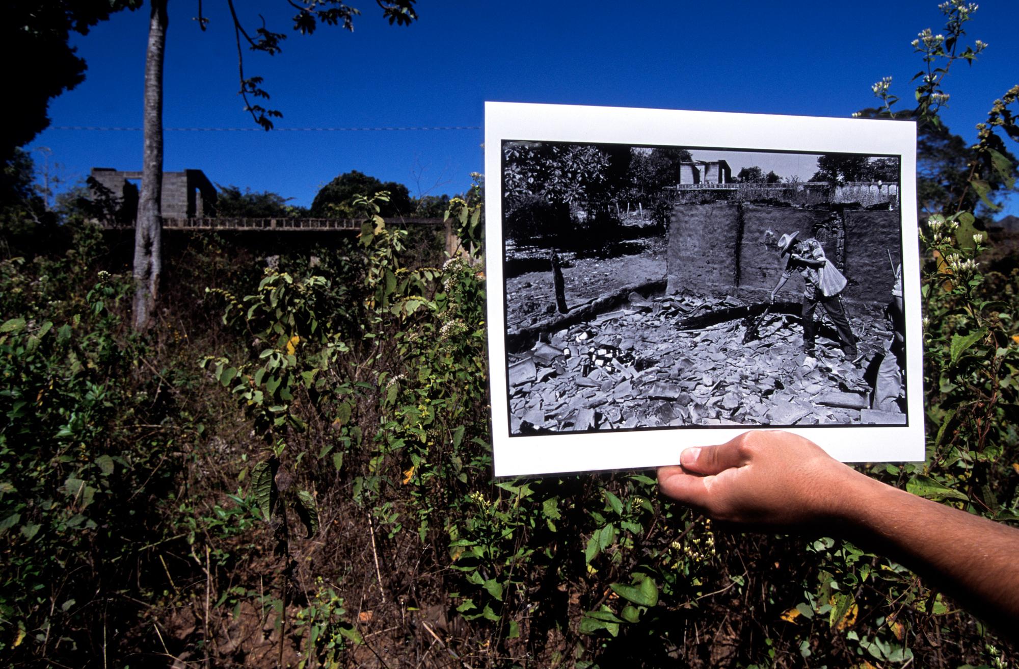 El Salvador Anniversary - Team holding photograph taken by Susan Meiselas in Jan....