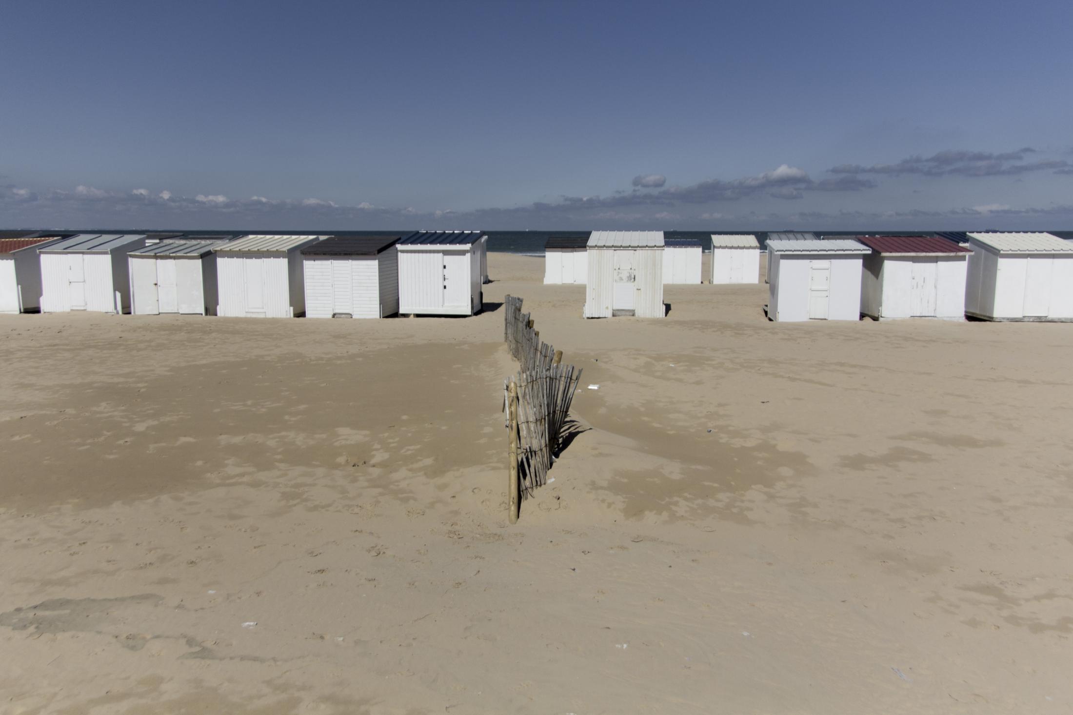 Latent urbanities - Calais&#39;beach in front of the English coast and its touristic shelters,
Calais, France...