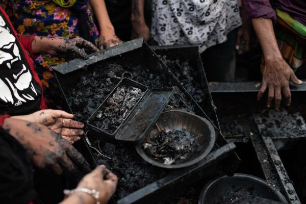 Slum dwellers search for their household items after a massive fire broke out in Maniknagar slum at Mugda in Dhaka, Bangladesh.