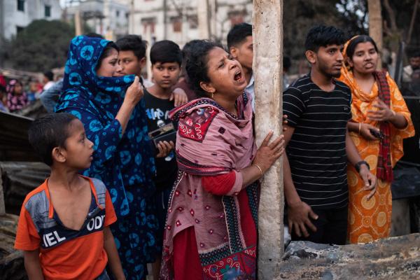 Slum dwellers mourn after a massive fire broke out in Maniknagar slum at Mugda in Dhaka, Bangladesh.