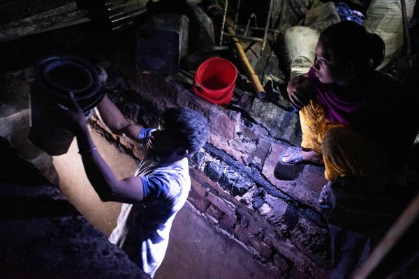 Slum dwellers search for their household items after a massive fire broke out in Maniknagar slum at Mugda in Dhaka, Bangladesh.
