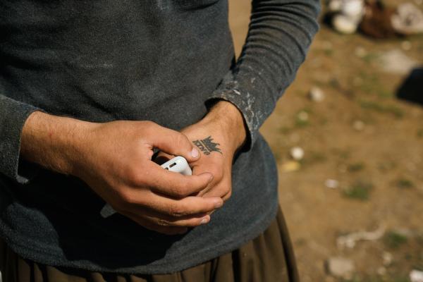 Stuck: The plight of Turkey's Afghan migrants - Umer, 16, got a tattoo on his right hand he was taken into custody by the Taliban for 18 days and...