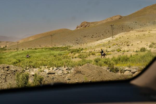 Stuck: The plight of Turkey's Afghan migrants - Man riding horses near the Iranian border. Van, Turkey 2021