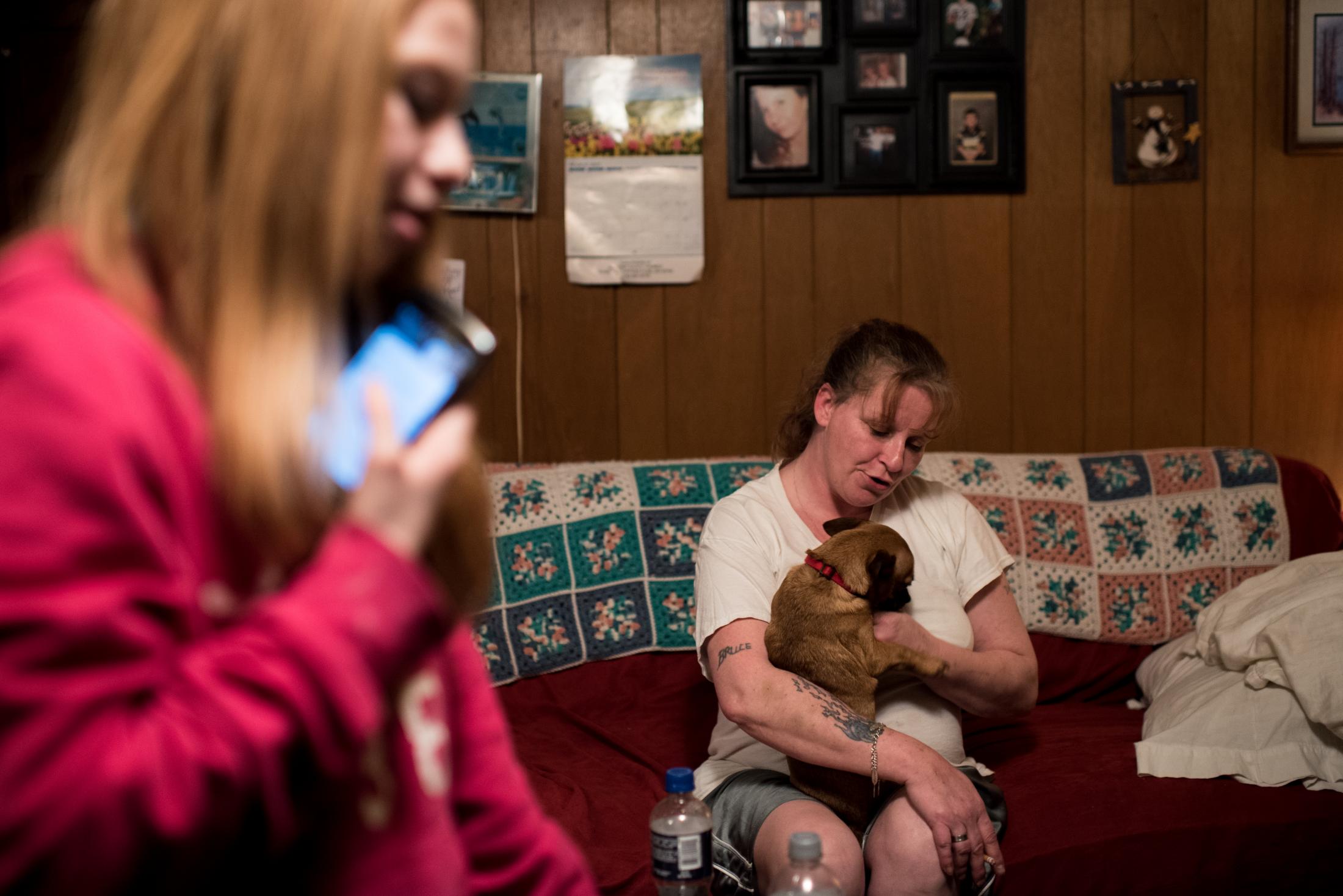 Coolville, Ohio - Mother, daughter, and the family dog spend an evening...