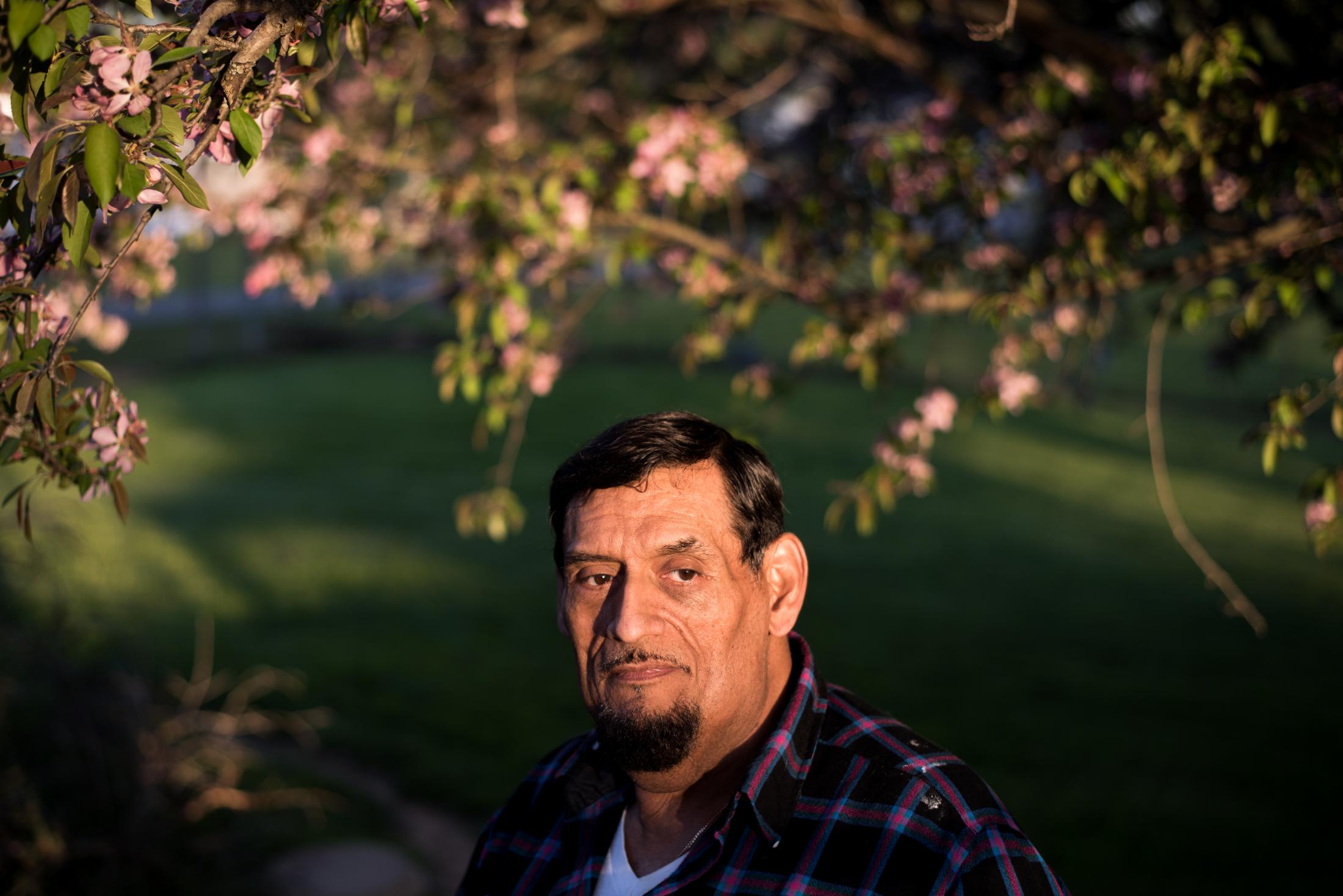 Coolville, Ohio - Roland Garcia poses for a portrait in his backyard in...