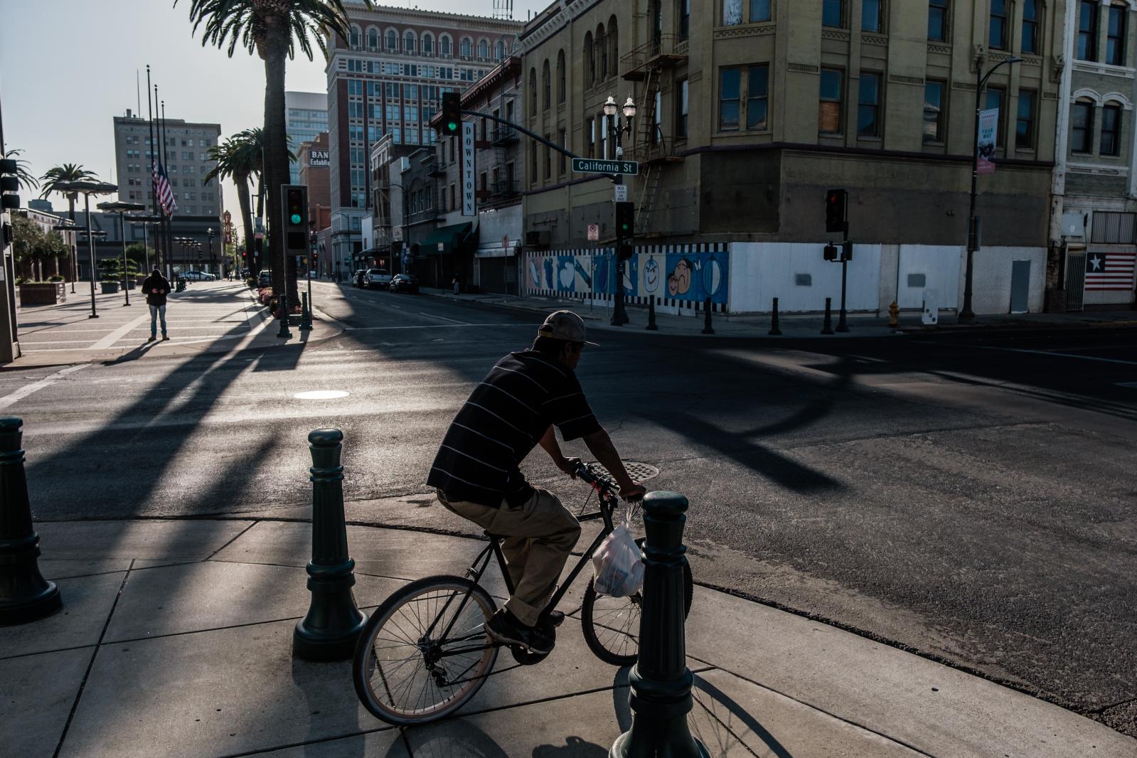 Image from Universal Basic Income: Trying to save a city - STOCKTON, CA - APRIL 5: A bicyclist is seen riding...