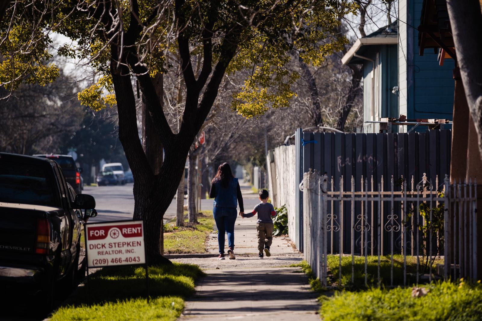 Image from Universal Basic Income: Trying to save a city - STOCKTON, CALIFORNIA-FEBRUARY 7: A mother and son walk...