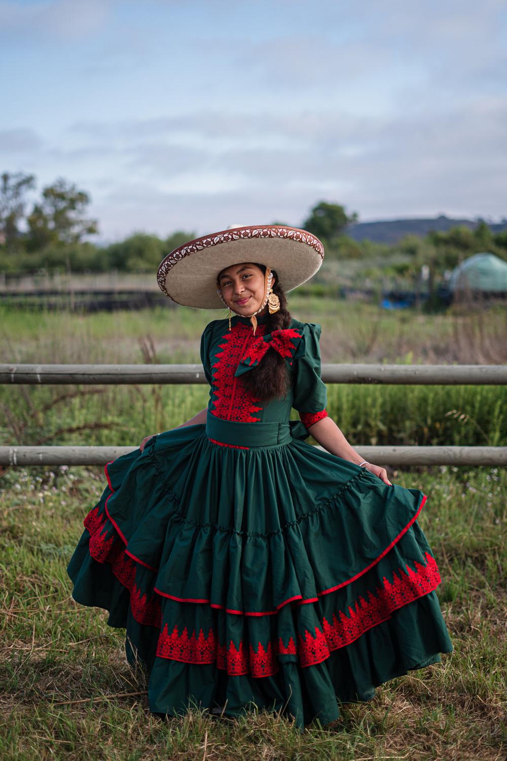Karen Castillo, 13 years old poses for a photo near the charrer&iacute;a competition at Rancho La Laguna in San Ysidro on June 20, 2021. Castilo who attends some of the charrer&iacute;a events hopes to become a rider of an &#39;escaramuza, an only female equestrian team.